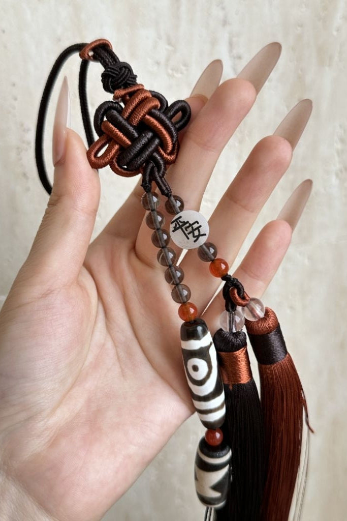 Your Dzi Hanger, prepared for your adjusted number, blessed and activated, then hung in your home.
